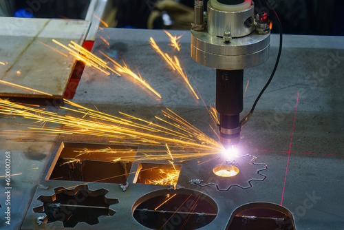 Close-up scene the laser cutting machine cutting  machine cut the metal plate with laser beam marking. photo