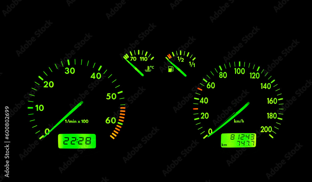 The green neon car dashboard over a black background The green neon car dashboard over a black background