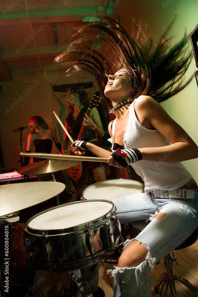 Naklejka premium Caucasian girl band playing instruments.