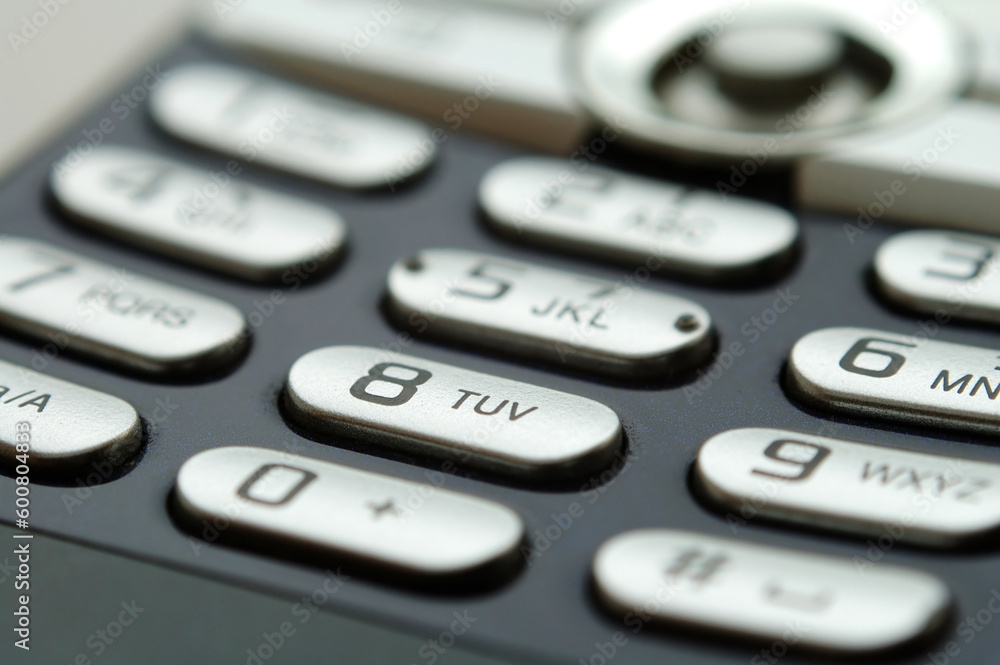 A close up shot of mobile keypad under light A close up shot of mobile keypad under light