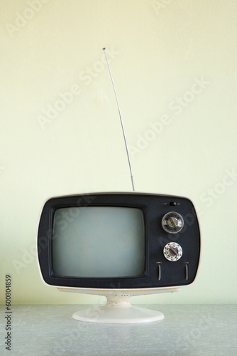 Still life of vintage television set with antenna raised. photo