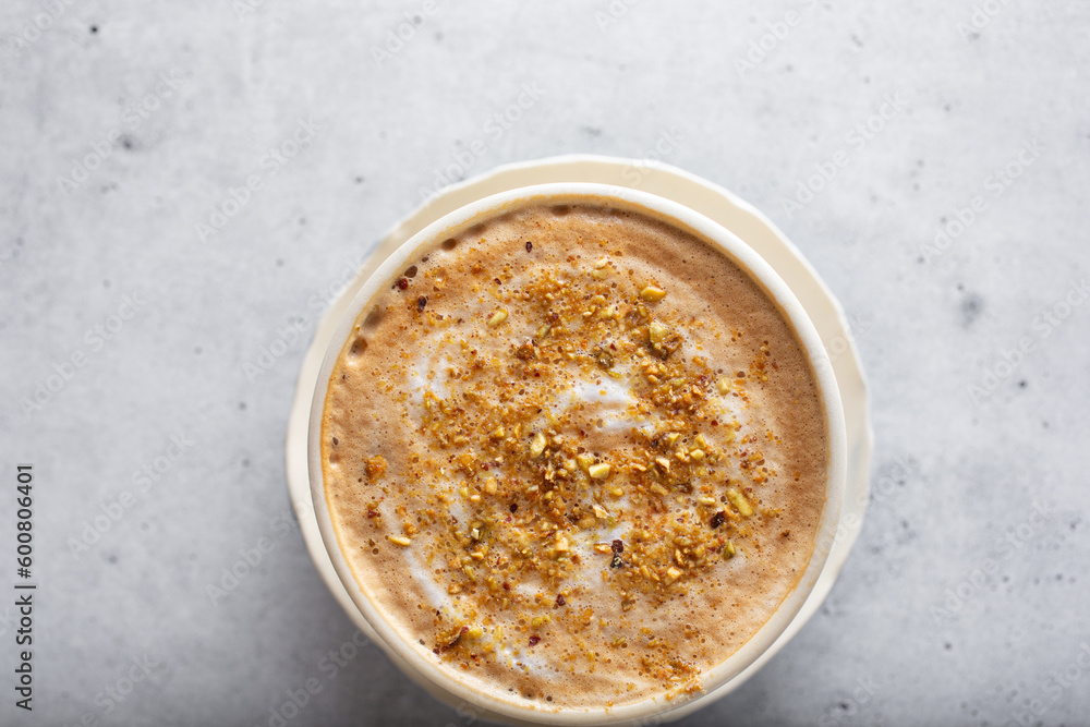 A top down view of a pistachio cappuccino. A top down view of a pistachio cappuccino.