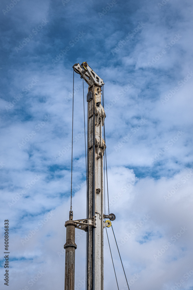 Industrial drilling machine at the construction site. Heavy duty machinery. Industrial drilling machine at the construction site. Heavy duty machinery.