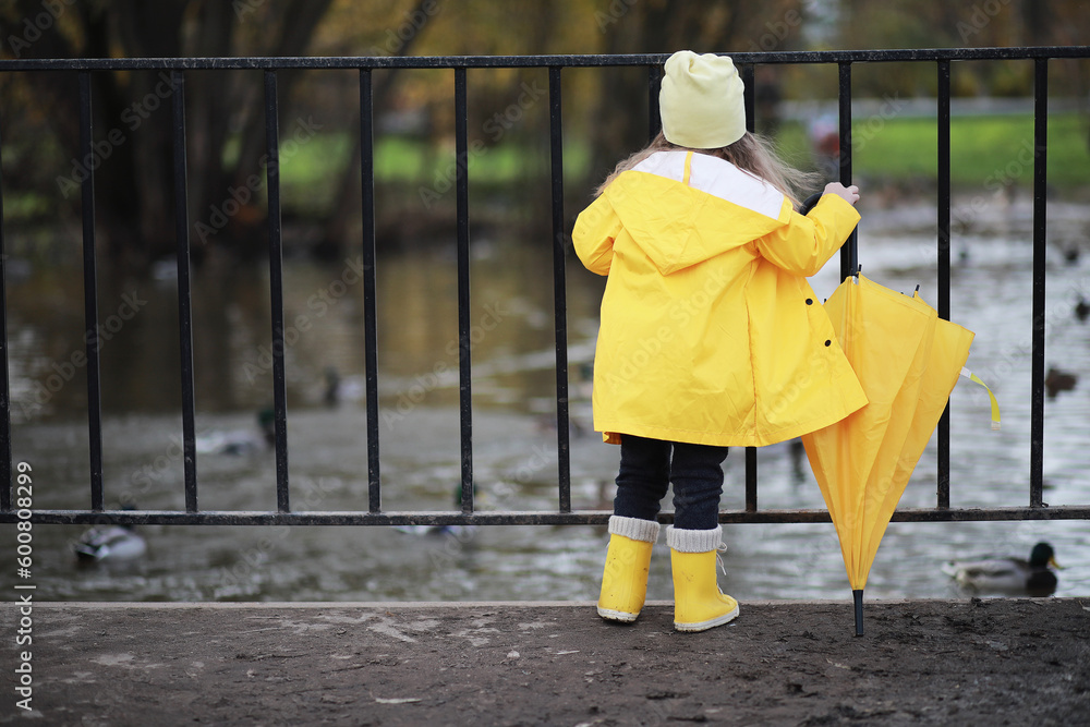 Children walk in the autumn park Children walk in the autumn park