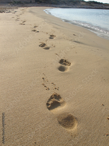 beautiful footprints on golden sand of greece islands