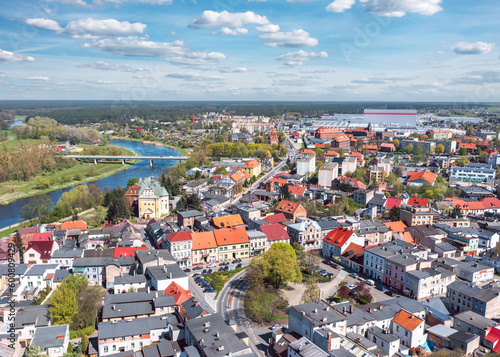 Obraz na płótnie Cityscape of Wronki, Wielkopolska, Poland. Aerial summer view of the city on the bank of Warta river. w salonie