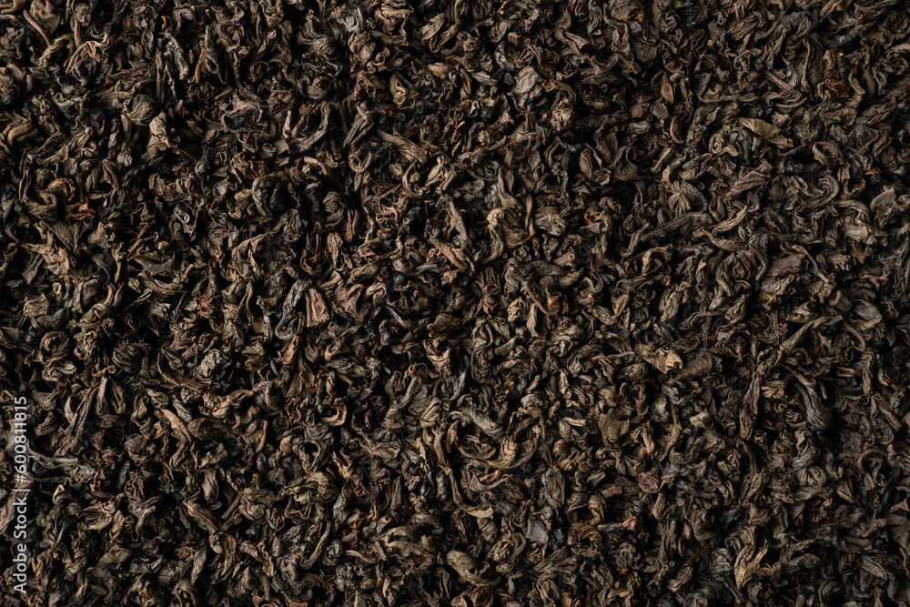 Background of black fanning or broken loose leaf tea. Close up, top view Background of black fanning or broken loose leaf tea. Close up, top view