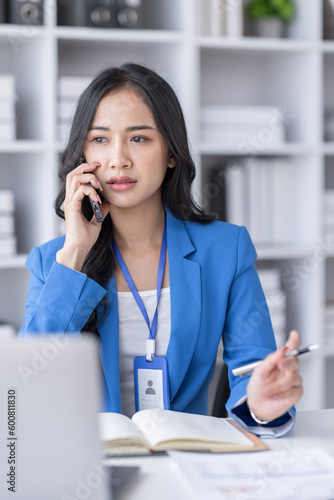 Wallpaper Mural Cheerful employees business Asian woman freelancer making telephone call share good news about project working in office workplace, business finance concept.	 Torontodigital.ca