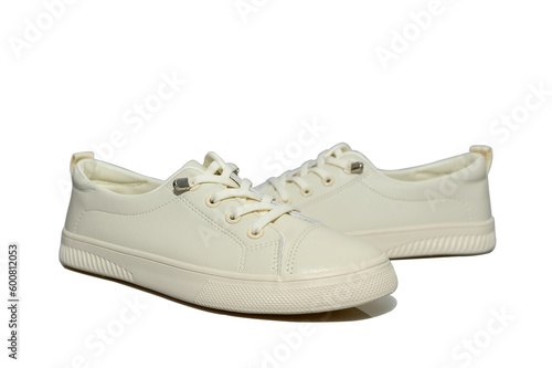 White unisex sneakers with white laces. Modern comfortable shoes.