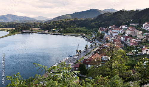 Aerial view of the bay and town of San Esteban de Pravia in Asturias at sunset and in spring.