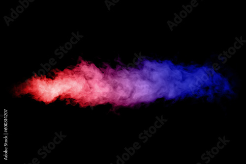 Artificial smoke in red-blue light on black background in darkness.