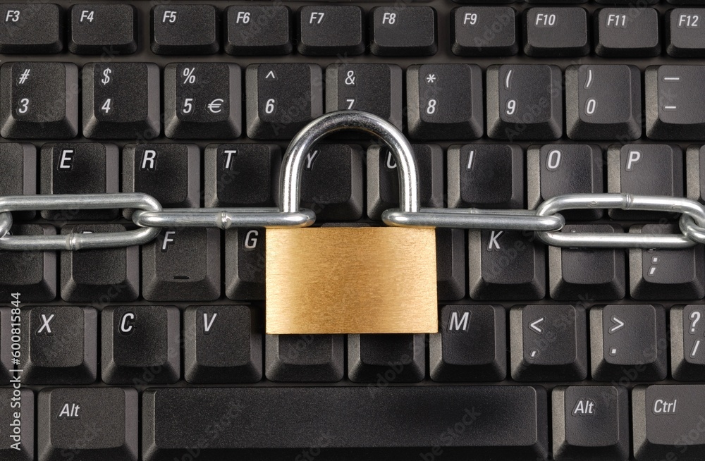 Macro of padlock and chain on computer keyboard Macro of padlock and chain on computer keyboard