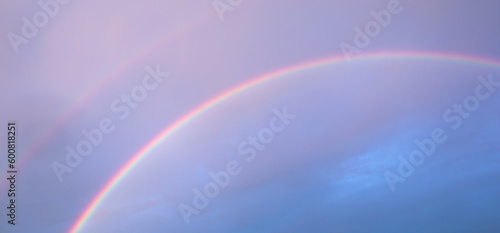 Captivating Double Rainbow in the Cloudy Sky © maykal
