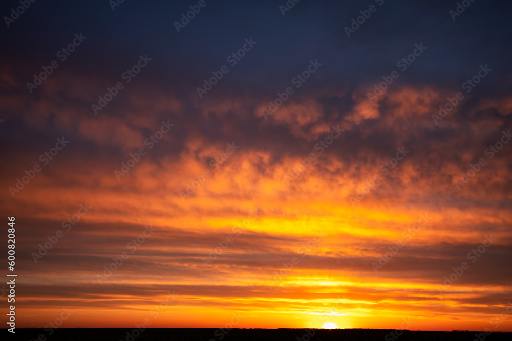 Golden Sunset: Silhouetted Clouds at Dusk or dawn