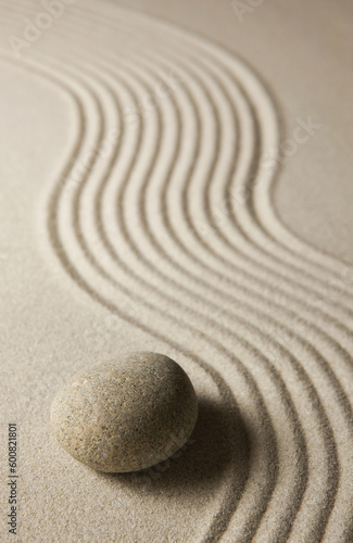 Stone on raked sand. Zen concept.