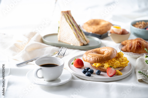 Breakfast eggs berries and strawberry fruit on a white plate