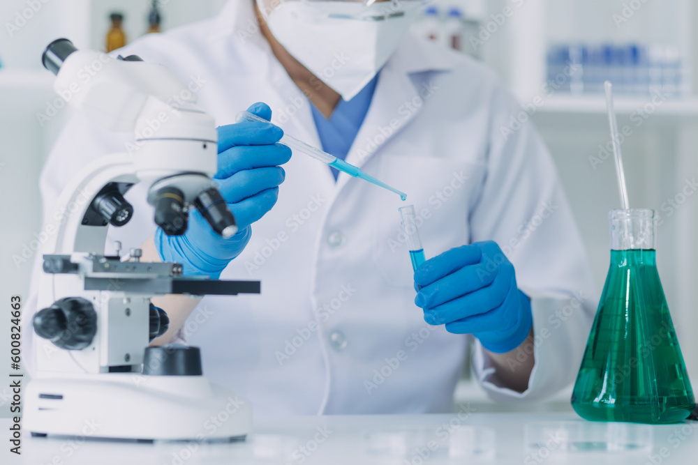 Fototapeta premium Medical Development Laboratory: Caucasian Female Scientist Looking Under Microscope, Analyzes Petri Dish Sample. Specialists Working on Medicine, Biotechnology Research in Advanced Pharma Lab