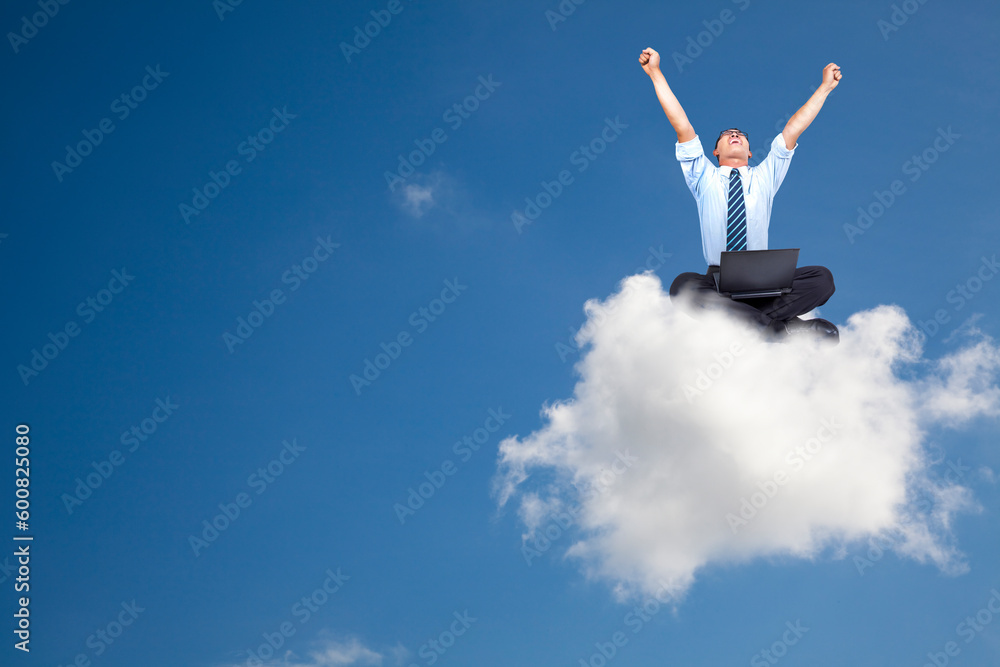 Young businessman with computer sitting on the cloud Young businessman with computer sitting on the cloud