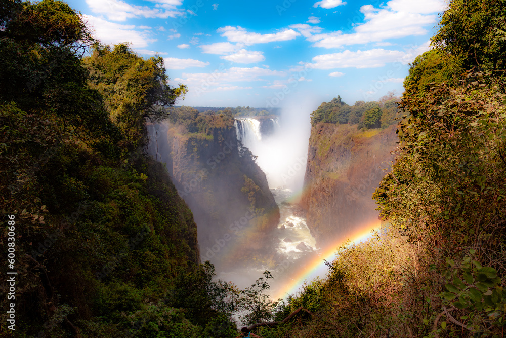 A double-rainbow provides a touch of magic at the spectacular Victoria Falls in Zimbabwe - obrazy, fototapety, plakaty 