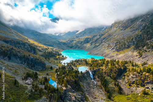 Amazing nature landscape turquoise Kuyguk waterfall and Kuiguk lake in Altai mountains, Siberia Russia. Aerial top view