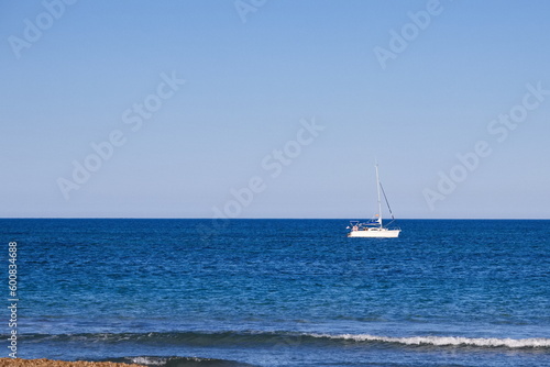 Nice seascape with boats going through the surf in vacation time