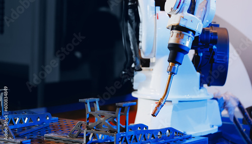 CNC Automatic robot arm manipulator for welding parts in industrial production