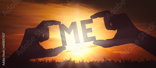 Me - human hands holding black silhouette word