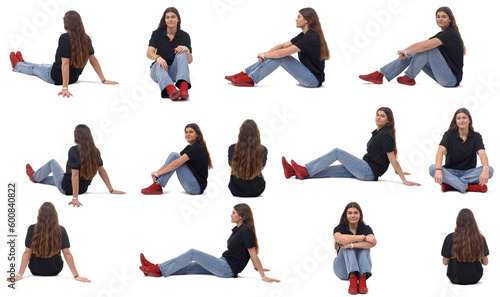  large group of same young girl sitting on the floor on white background