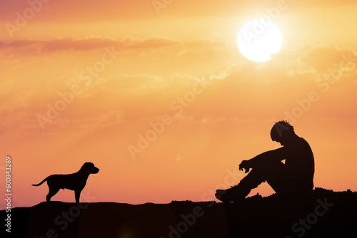 Desperate and lonely man in the evening have a dog as a friend