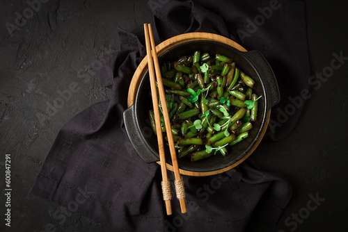 fried bean pods, in soy sauce, with sesame seeds, homemade, no people,