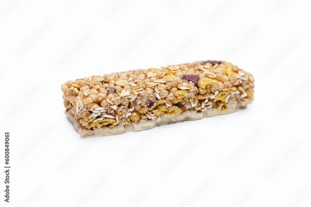 A muesli bar made from oatmeal on a white isolated background. Healthy sweet dessert snack. Cereal muesli with nuts, oatmeal and berries on a white background. Delicious and healthy dessert A muesli bar made from oatmeal on a white isolated background. Healthy sweet dessert snack. Cereal muesli with nuts, oatmeal and berries on a white background. Delicious and healthy dessert