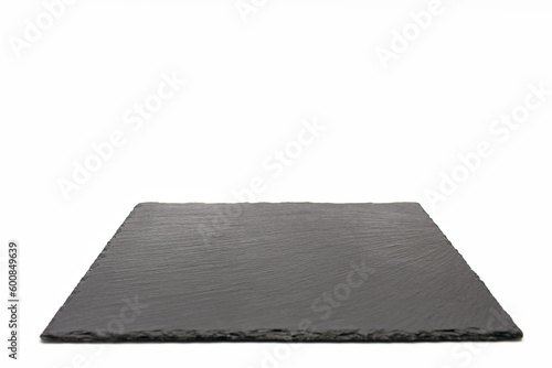 Black slate board on a white isolated background. Empty space for text or design image. Thin slate coaster for cooking or restaurant menus. Free space for text