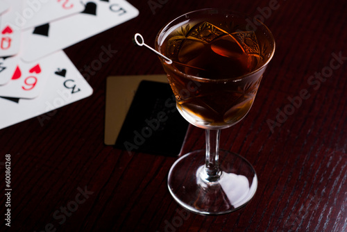 Cognac in fashion glass with cards photo