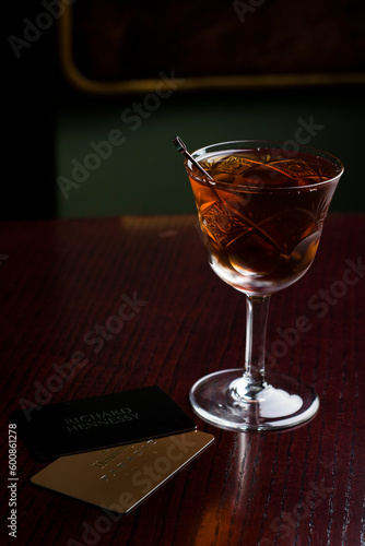 Cognac in fashion glass with cards photo