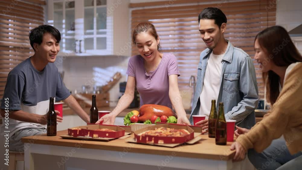 Group of Asian friends enjoying an evening party together at home. Group of Asian friends enjoying an evening party together at home.