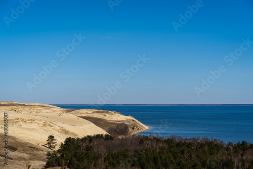 Baltic sea from Curonian Spit. The Gray Dunes, or the Dead Dunes is sandy hills with a bit of green specks at the Lithuanian side of the Curonian Spit