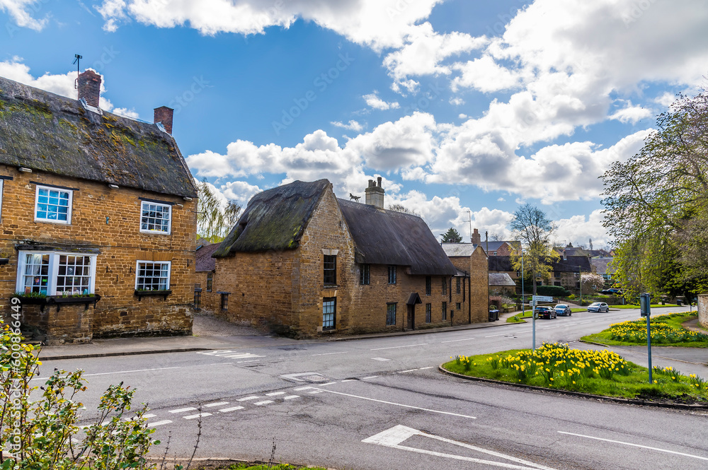 A view across the high street and main street junction in Brixworth, Northamptonshire, UK in summertime A view across the high street and main street junction in Brixworth, Northamptonshire, UK in summertime