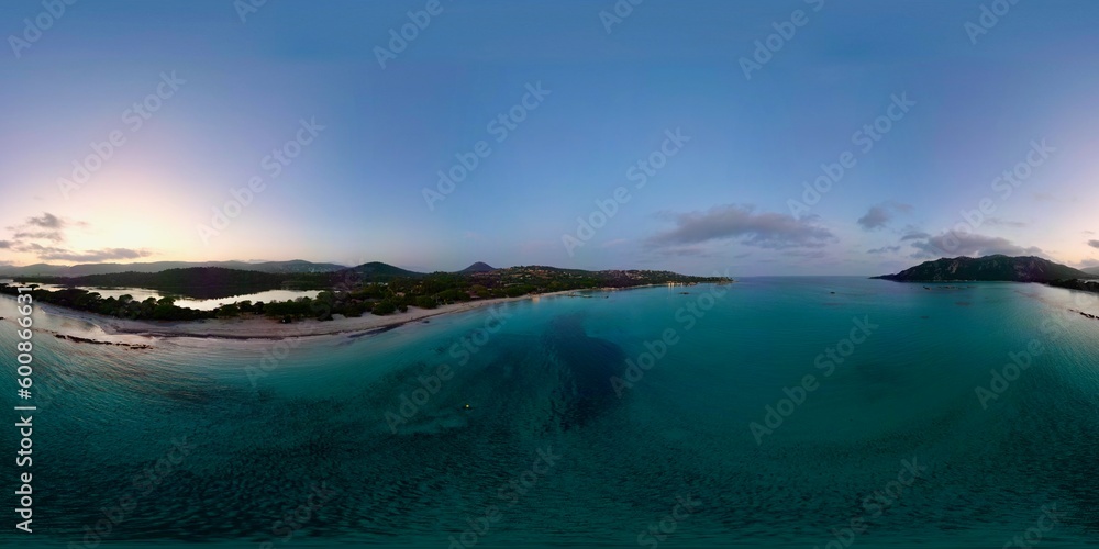 360 Panoramic Mesmerizing Aerial Drone Footage of Santa Giulia Beach, Porto-Vecchio, Corsica - An Exquisite Sunset Panorama Amidst Clear Blue Waters and Verdant Scenery