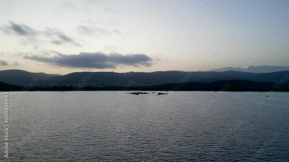 Twilight Tranquility: A Majestic Flight over Santa Giulia Beach, Porto-Vecchio, Corsica - Unveiling Half-Lit Landscapes from Serene Shores to the Mountain Horizon Twilight Tranquility: A Majestic Flight over Santa Giulia Beach, Porto-Vecchio, Corsica - Unveiling Half-Lit Landscapes from Serene Shores to the Mountain Horizon