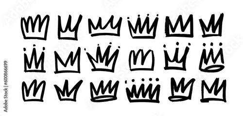 Set of brush drawn crowns or diadems icons. Doodle diadems collection. Queen royal tiaras vector elements isolated on white. Hand drawn king crown charcoal sketches.