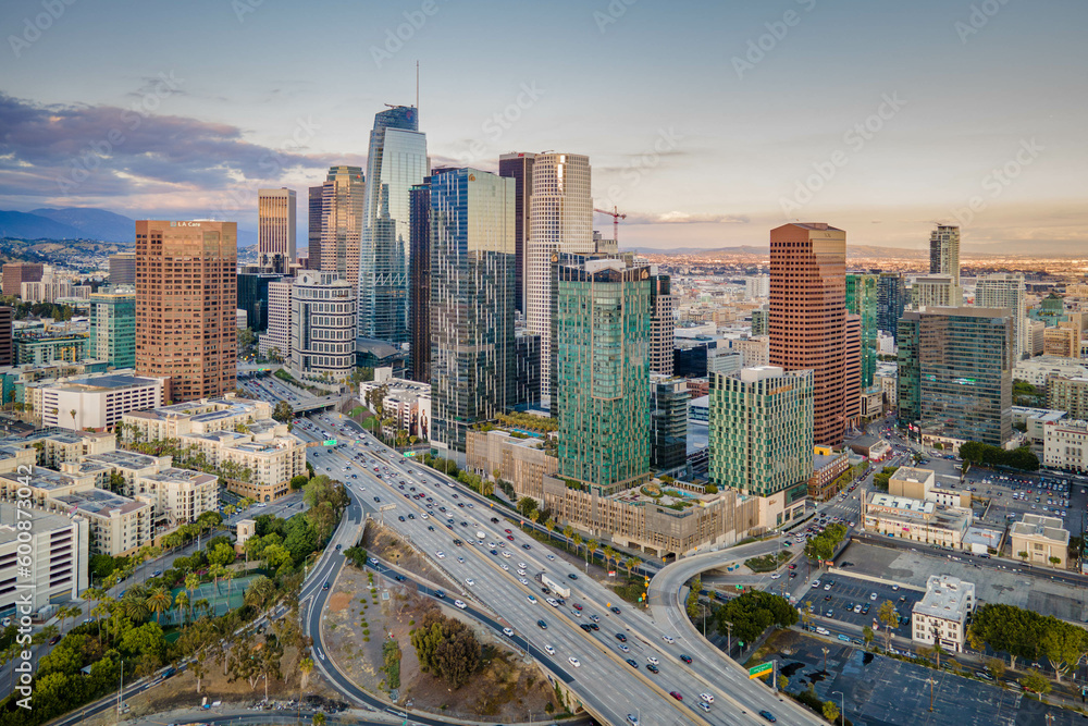 Los Angeles, California – May 3, 2023: aerial drone view toward LA downtown buildings with freeway 110 including hotel Indigo, Metropolis Los Angeles