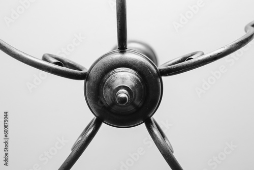 The central part of a chandelier hanging from the ceiling in the room