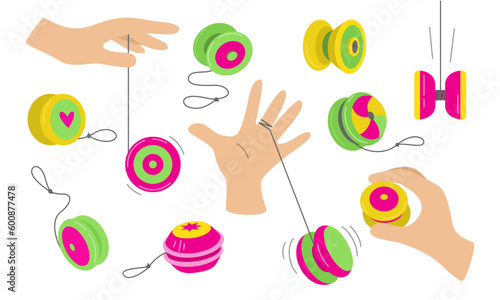 Isolated set of yo yo toys on a white background. The hand is playing with a toy. Fun and play. Vector flat illustration