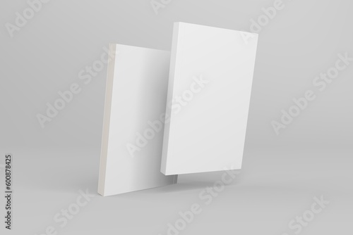 2 softcover book mockups are standing on a gray background, designed with 3D render visual effects that are indistinguishable from reality. A mockup, with flashy white covers resembling a real book.