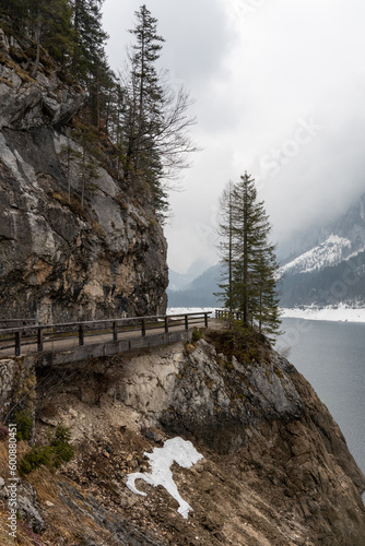 lake in the mountains with bridge in the fog