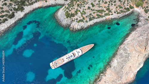Obraz na płótnie Aerial drone photo of luxury yacht with helipad anchored in tropical exotic island with emerald crystal clear sea w salonie
