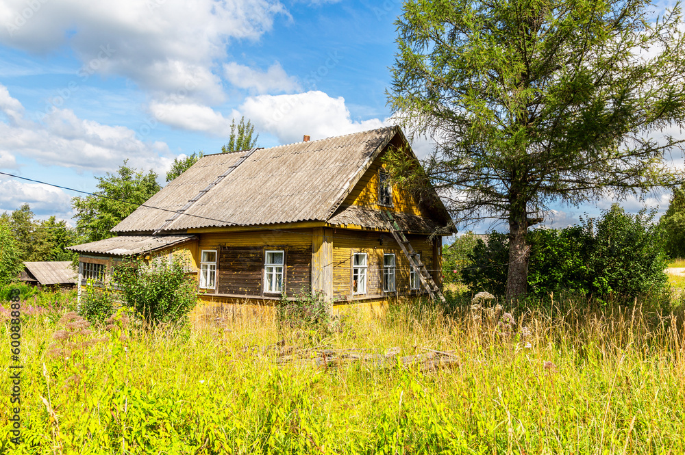 Countryside landscape with abandoned wooden house Countryside landscape with abandoned wooden house