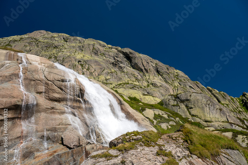 small waterfall of a mountain creek at Grimselpass