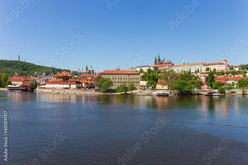 Spring colorful Prague Lesser Town with gothic Castle above River Vltava in the sunny Day, Czech Republic © Kajano