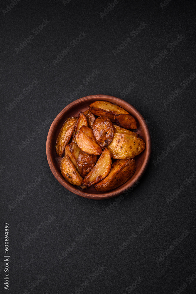 Delicious grilled potato slices with garlic, spices and herbs Delicious grilled potato slices with garlic, spices and herbs